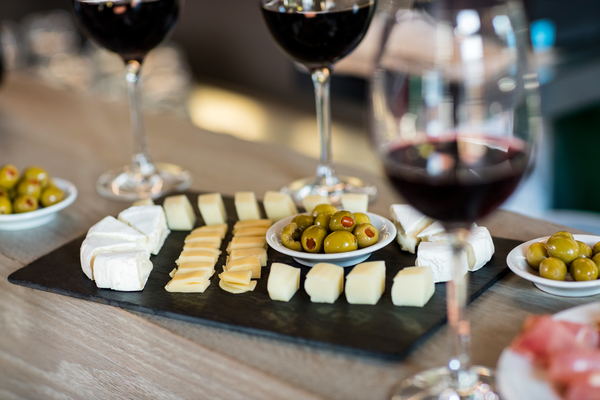 wine and food arranged on table