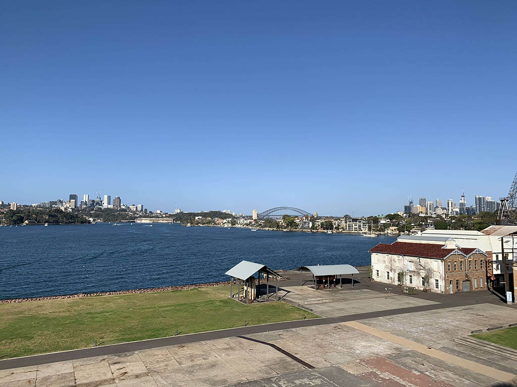 View from Cockatoo Island overlooking Sydney Harbour Bridge and sea, a prime location for watching New Year's Eve Sydney Fireworks.