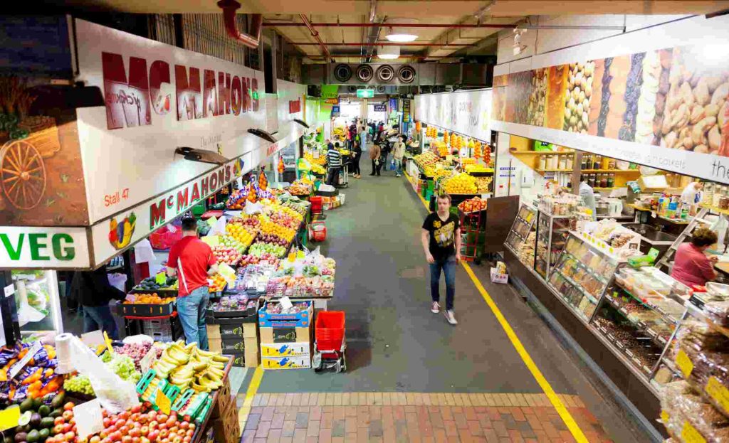 People shopping inside the Adelaide Central Market , which is a popular tourist attraction and large multicultural market in the central business district in Adelaide, Australia.