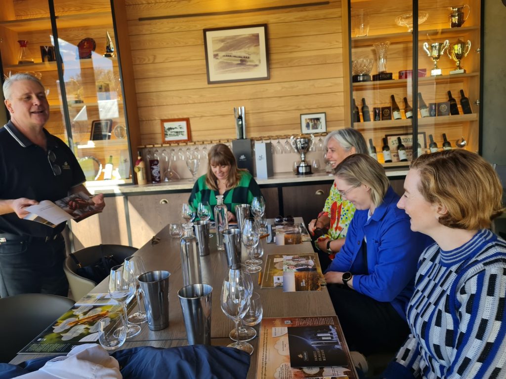 Wine guide hosting an intimate tasting session inside a boutique cellar door, showing the personalised experience guests enjoy on a private wine tour in Clare Valley.