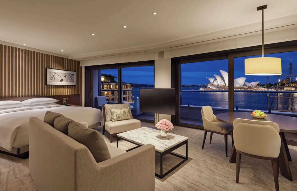 luxury suite at Park Hyatt Sydney in The Rocks with a direct night-time view of the illuminated Sydney Opera House across the harbour, making it one of the most iconic luxury hotels near the Sydney Opera House.