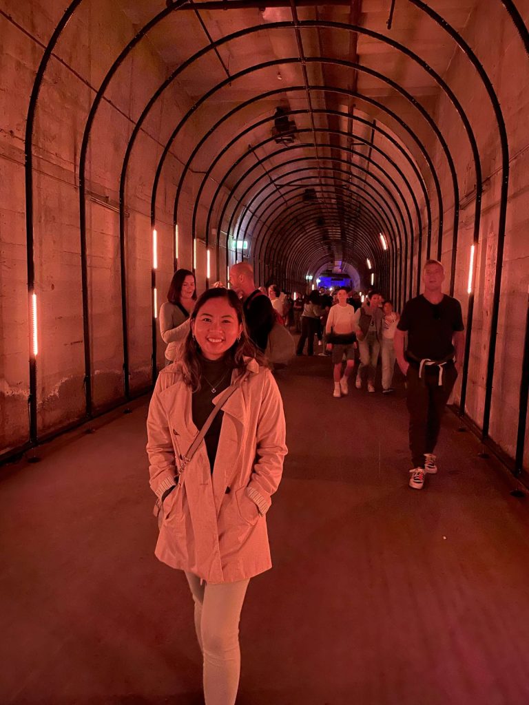 Me walking through illuminated tunnel installation at Dark Spectrum in Wynyard Tunnels during Vivid Sydney 2023, showcasing immersive light art and interactive festival experiences.