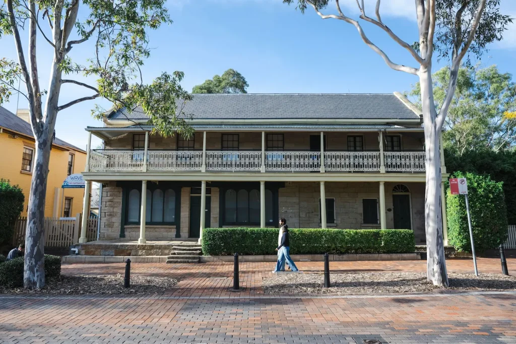 Old sandstone terraces on a sunny Campbelltown streetscape, one of the spookiest spots to explore around Sydney